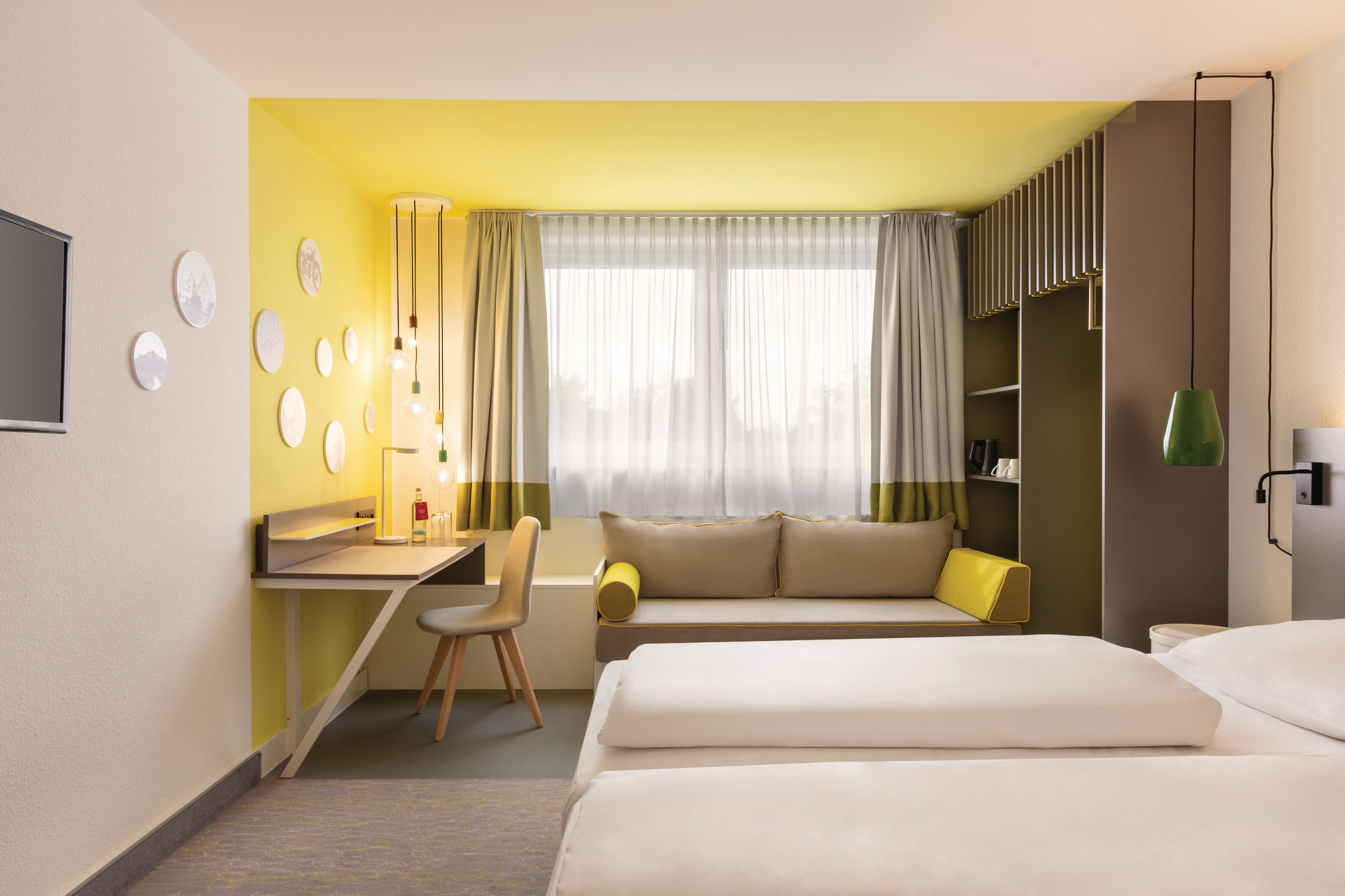 Vienna_House_Easy_by_Wyndham_Neckarsulm_Lounge_Zimmer