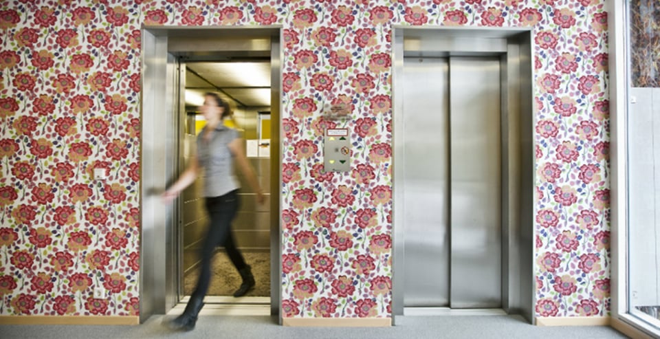 Woman in front of the lift