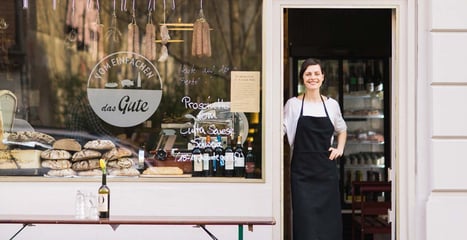 Woman in front of the Shop